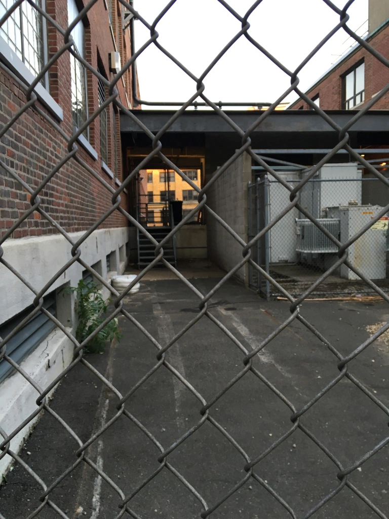 garage behind chainlink fence