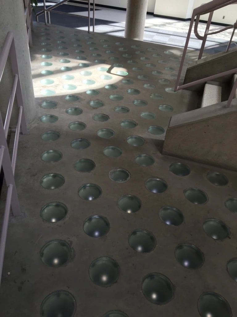 stairwell with glass circles on the ground