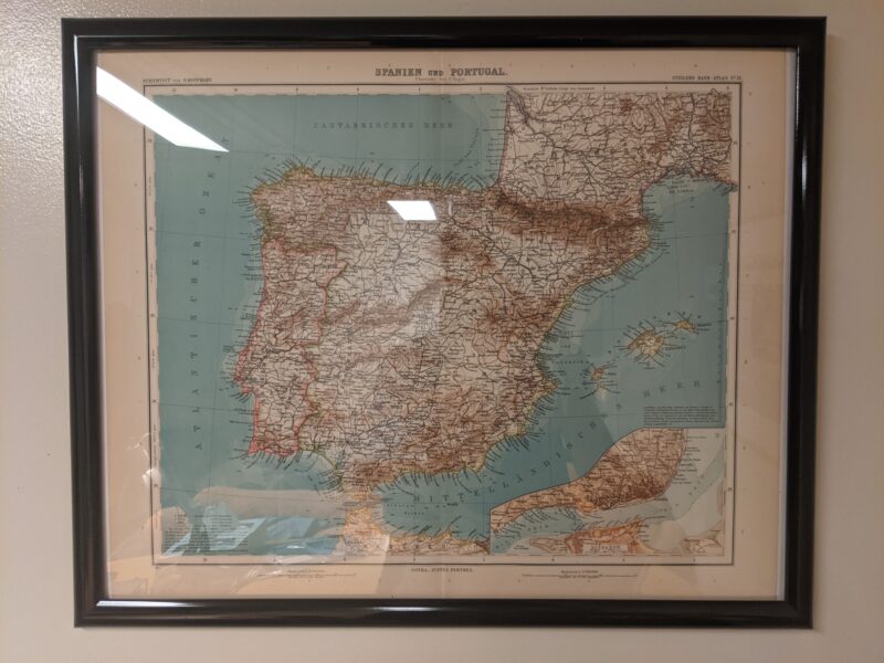 framed map of spain and portugal on a wall