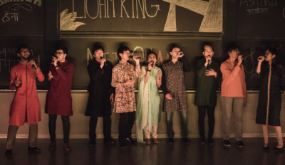 img showing ohms members wearing kurtas, a type of long shirt worn in south asia, during a concert