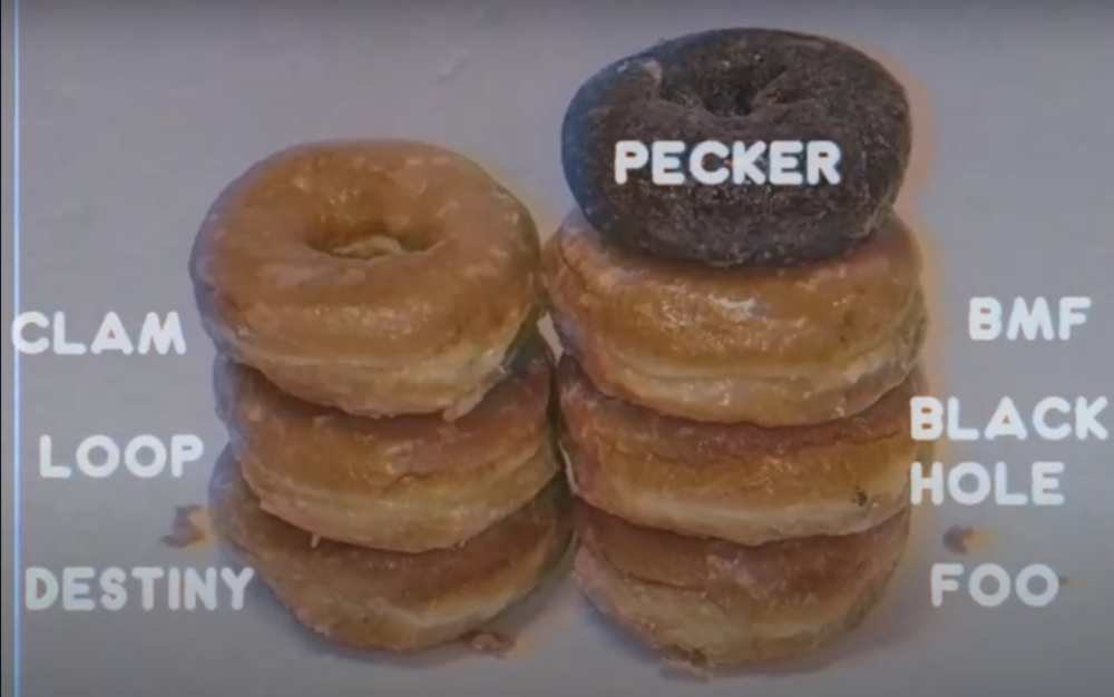 Two stacks of donuts, with a chocolate donut at the top right stack labeled "Pecker"
