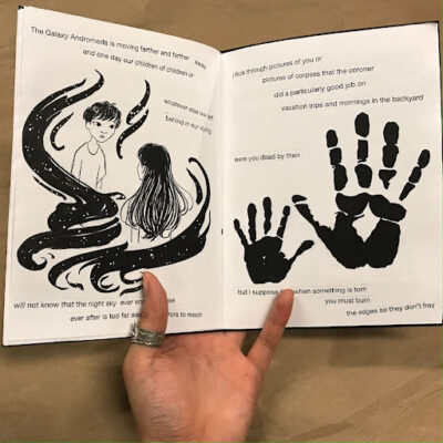 picture of the open zine with illustrations of a child and their mother speaking in between poetry