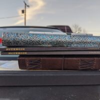 journals stacked on top of a car
