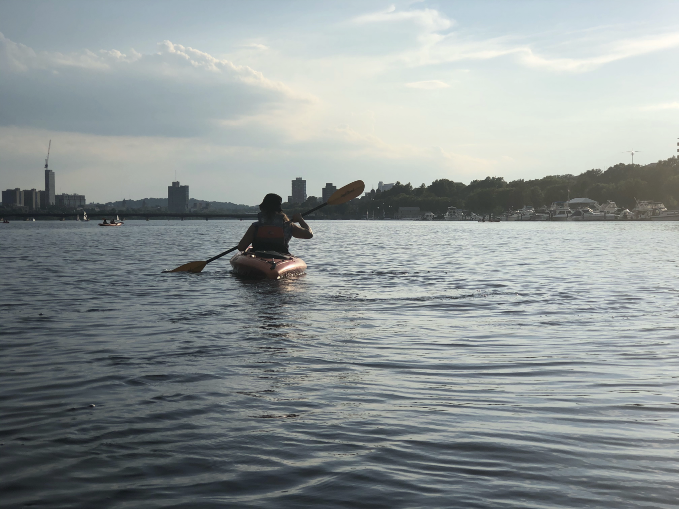 person in kayak in the Charles River