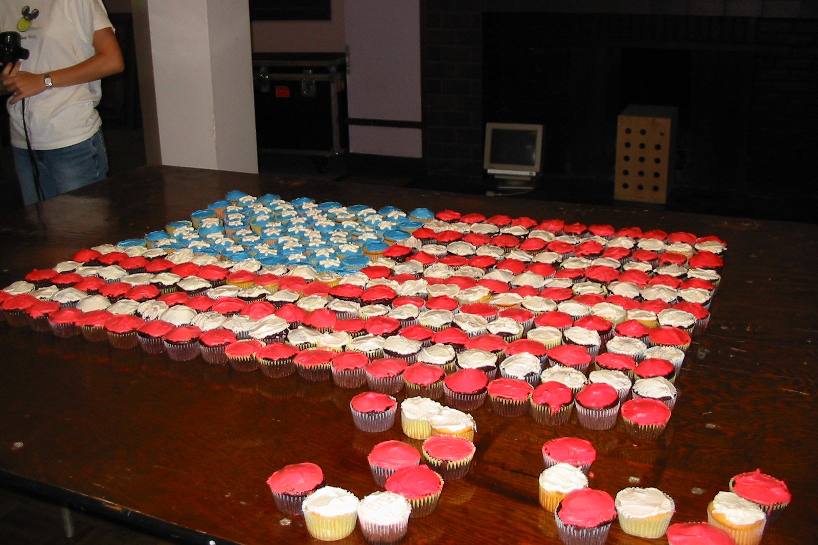 table full of cupcakes in shape of american flag