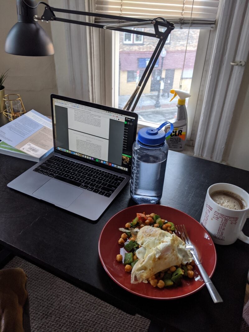 computer, eggs, and coffee on a table