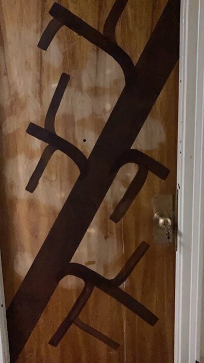 The tree trunk on my door: one very thick brown line, with many smaller ones branching off it.