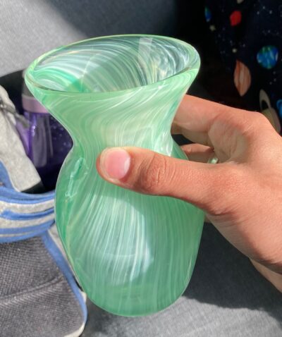 The same vase seen from an angle. It has a wide, round opening.