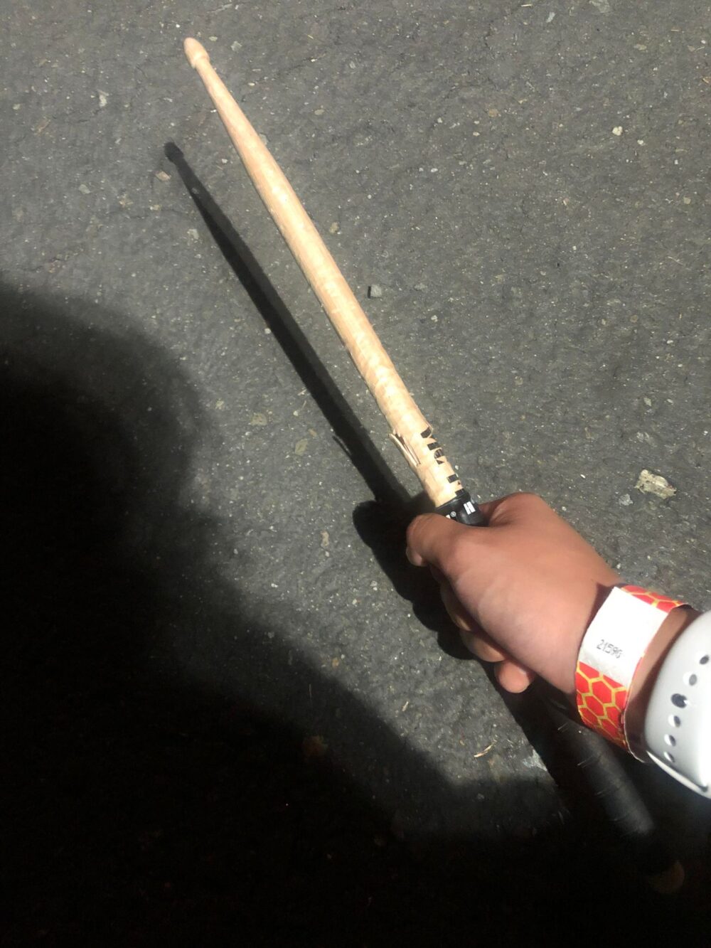 me holding a used drumstick