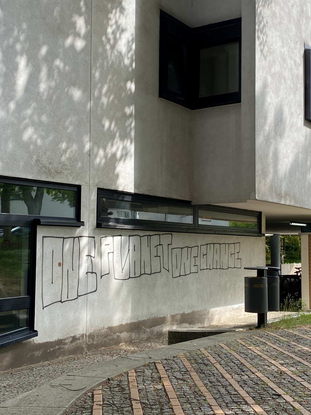 graffiti on white wall reading 