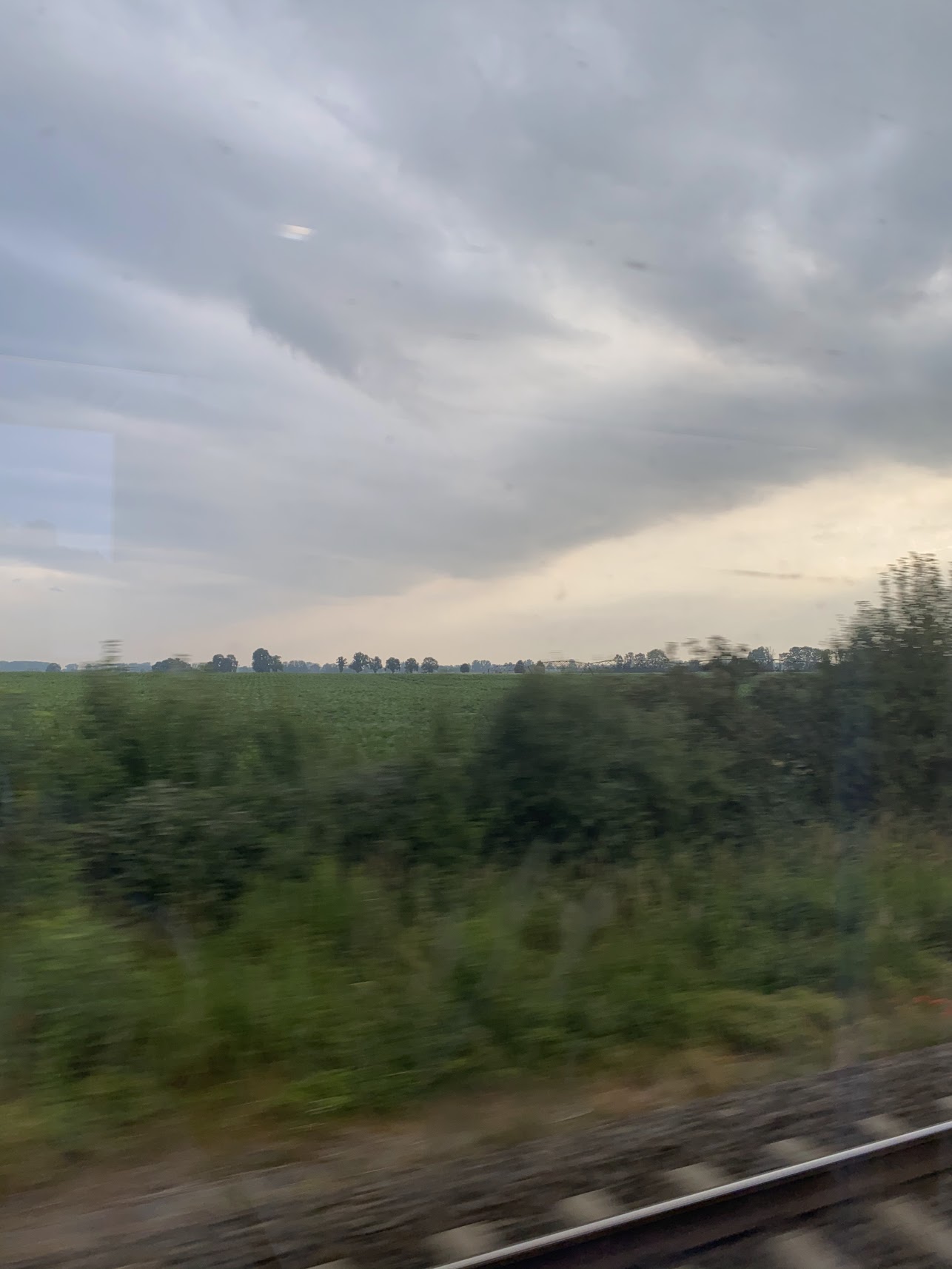 view of green field and rail tracks