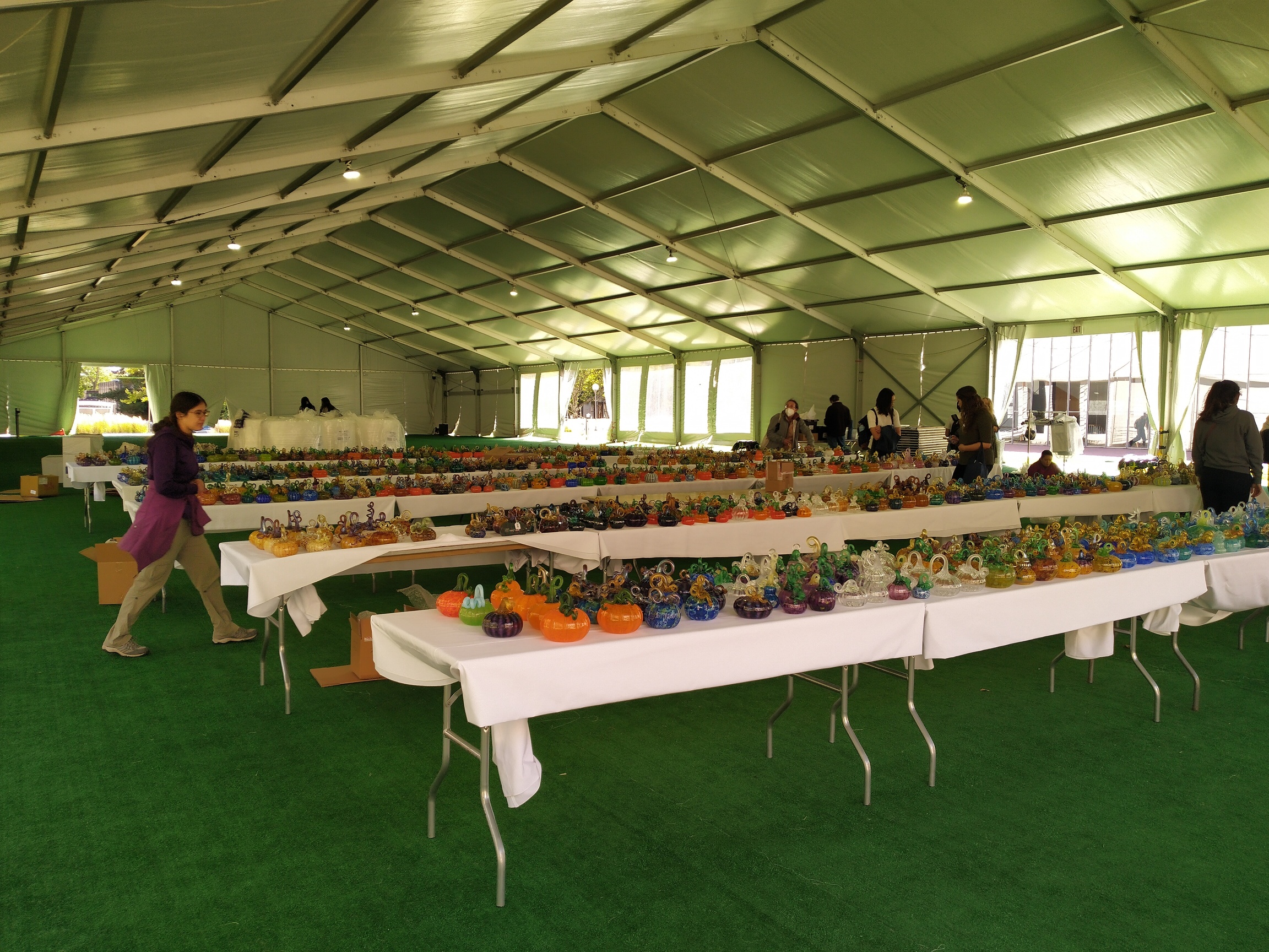 tables and tables of glass-blown pumpkins on top