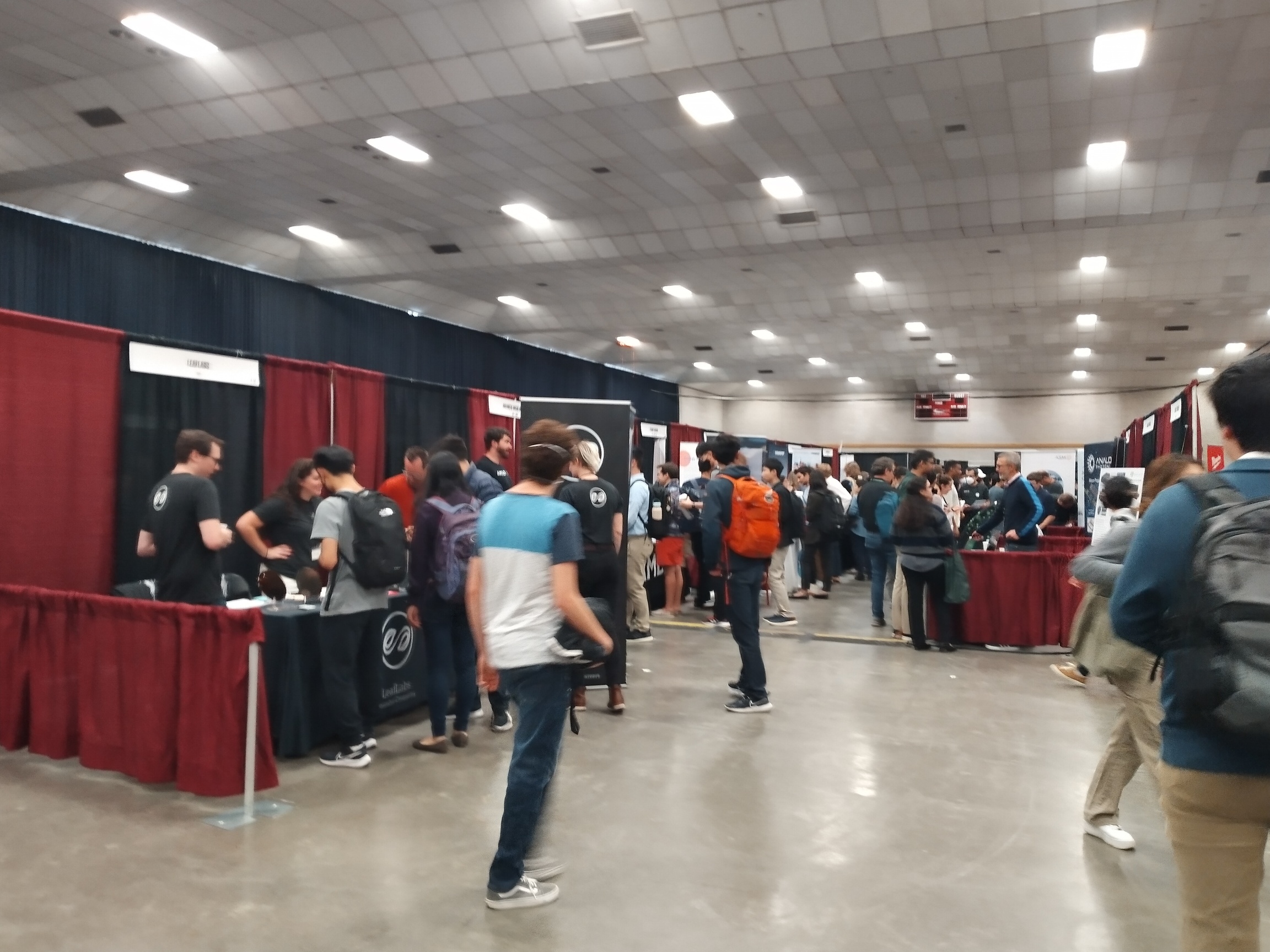 a hallway with several booths