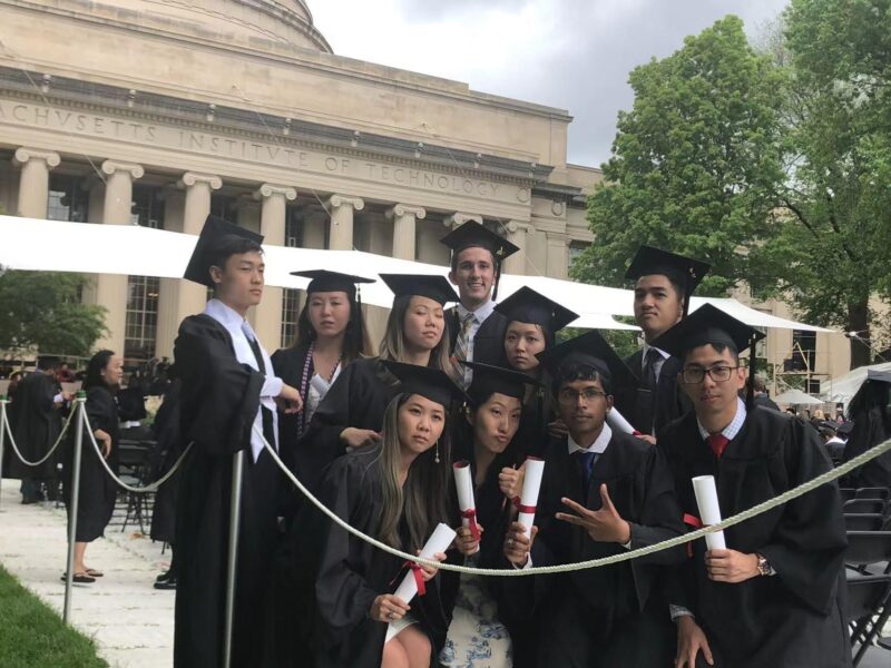 people holding diplomas, making serious faces