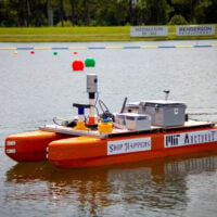 orange robotic boat with label 