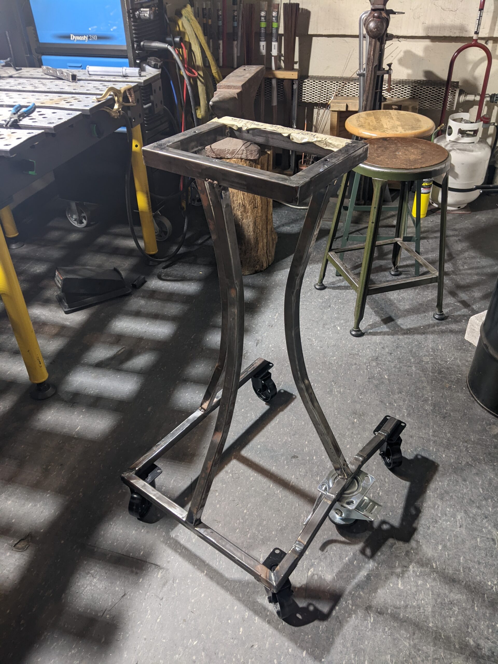 forge stand -- like a narrow coffee table but made of metal