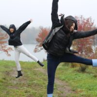 two girls jumping