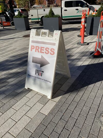 A sandwich sign set up outside. It says 