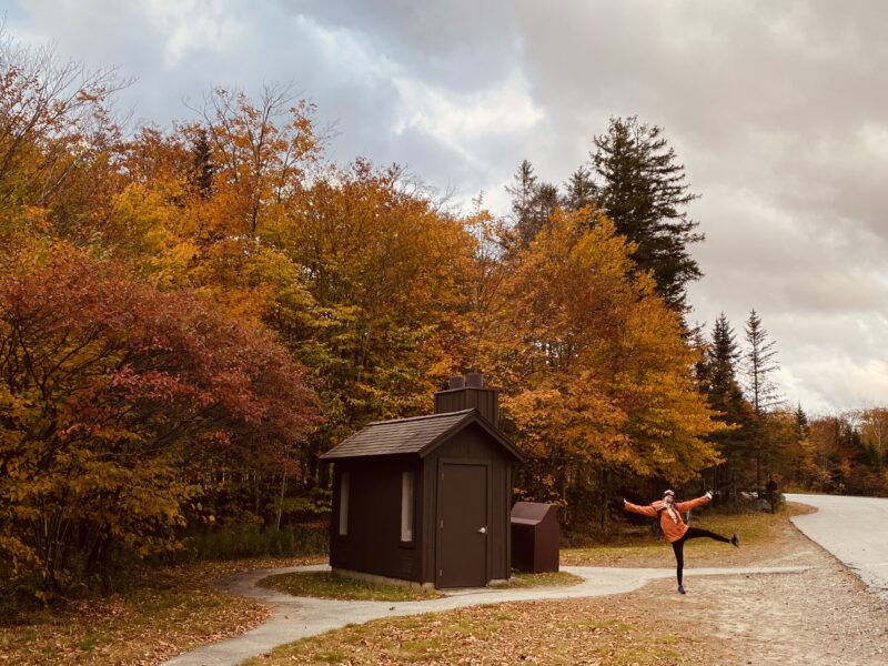 sierra the starfish next to a wooden restroom in the white mountains