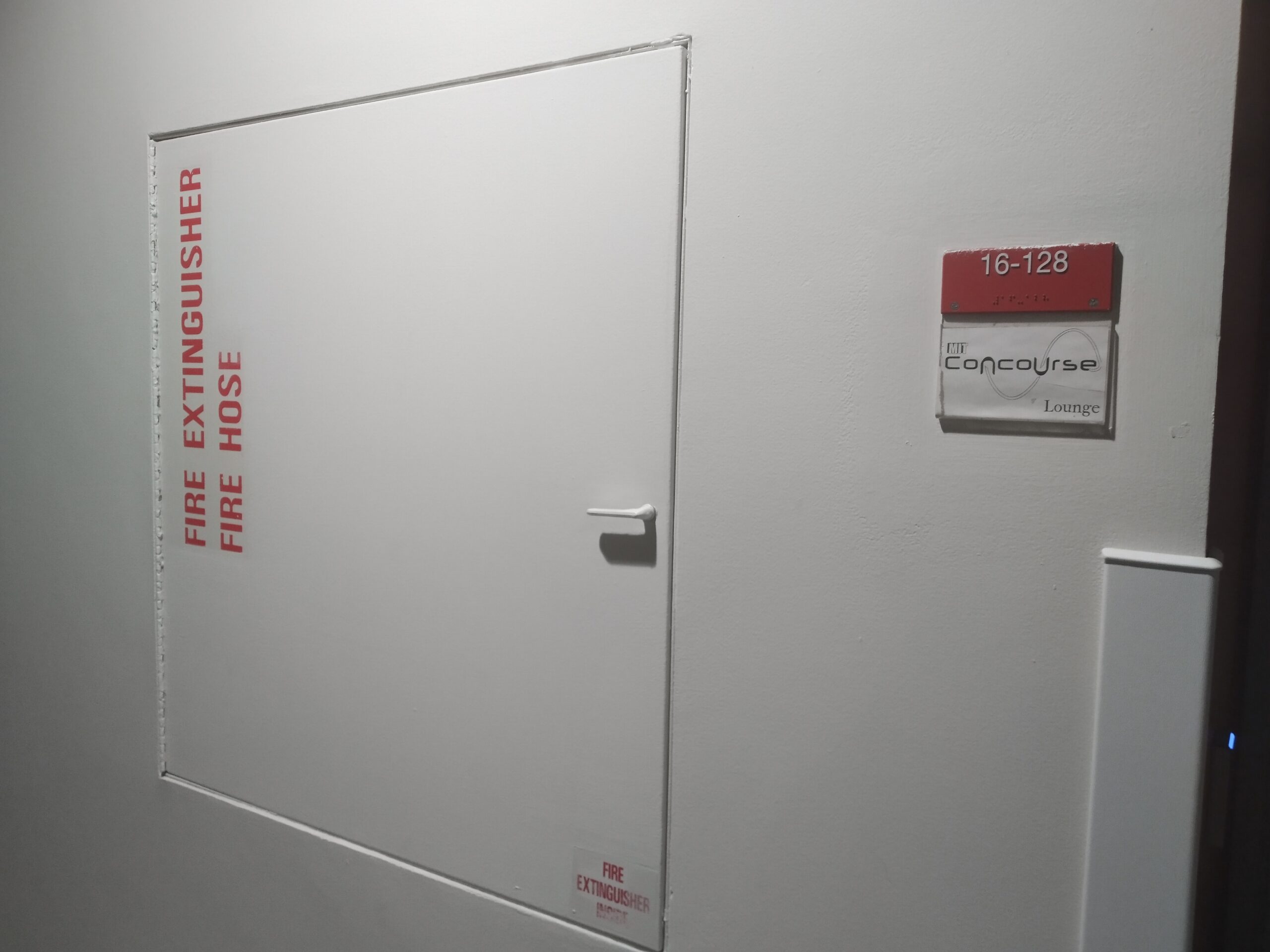 fire extinguisher box and room sign