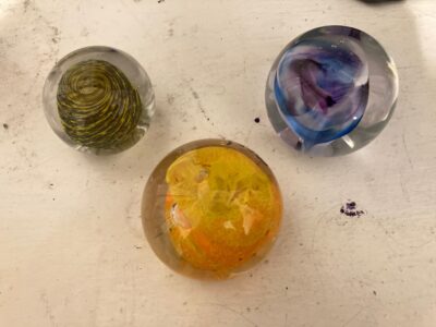 The same three paperweights seen from directly above.