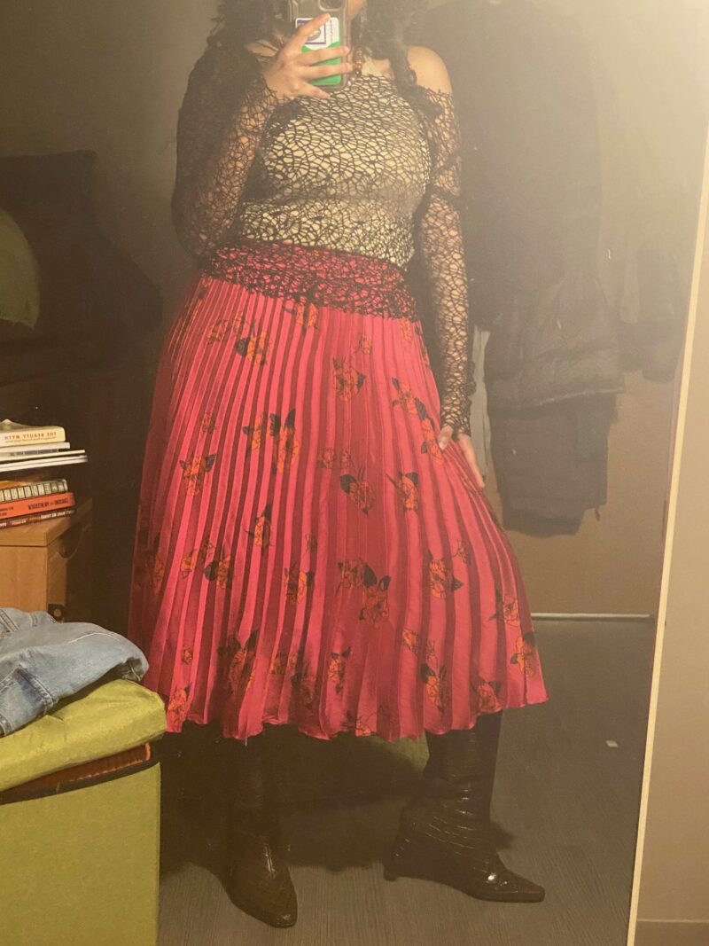 picture of a woman wearing pink skirt and brown boots