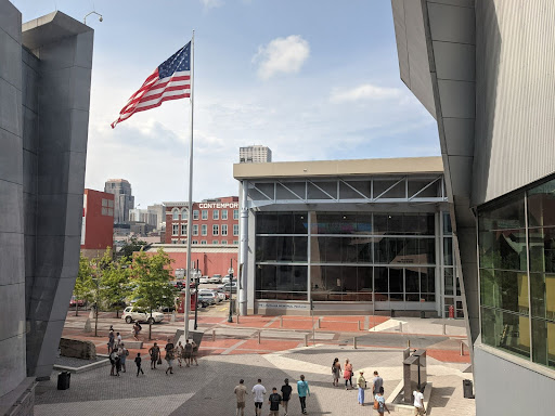 national ww2 museum with a flag pole next to a building