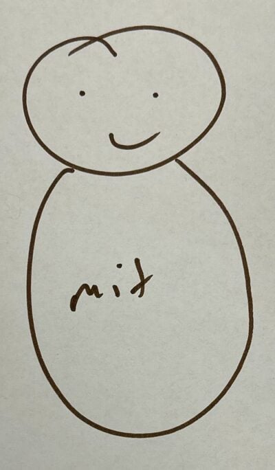 A drawing of of two ovals in brown marker, the top has a smiley face and the bottom says "mit." 