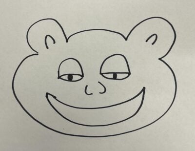A Tim beaver head drawn in brown marker that looks like a smug bear, with half-closed eyes and a toothless grin.