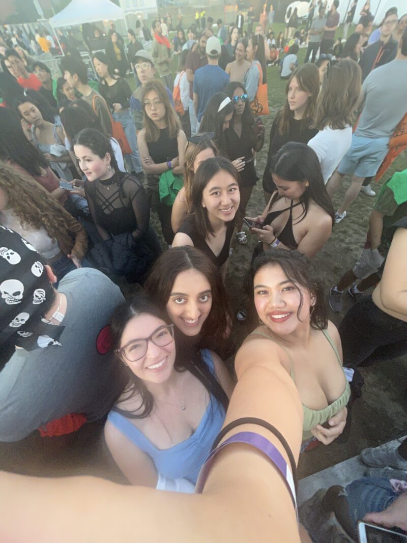 girls smiling for a photo at a concert
