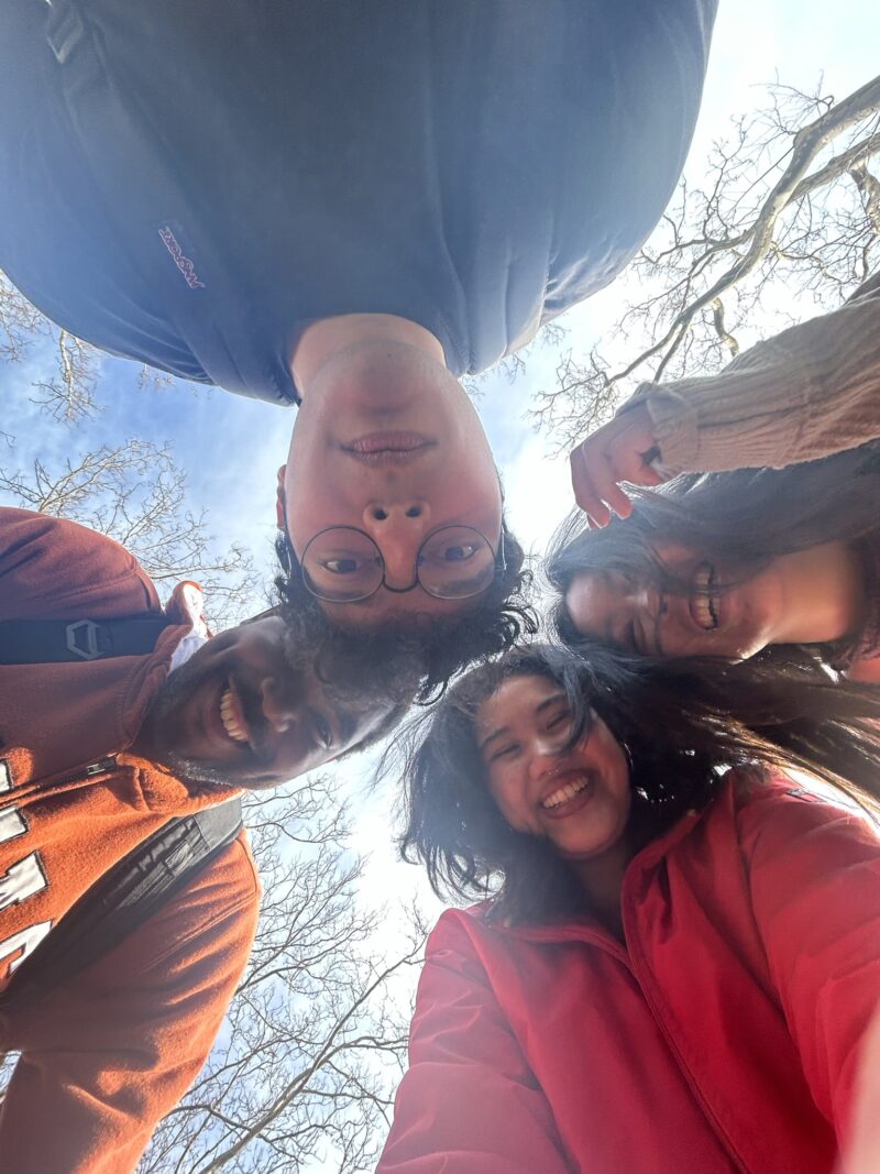 photo of people staring down at the camera smiling