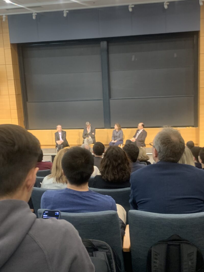 4 people sitting for a panel