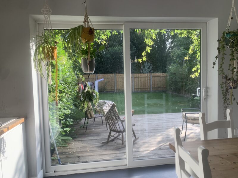 backyard greenery area as seen through glass doors