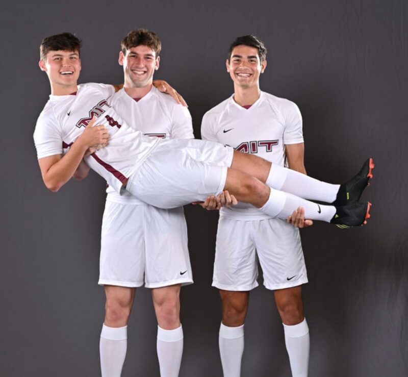 Men's soccer players posing during media day.