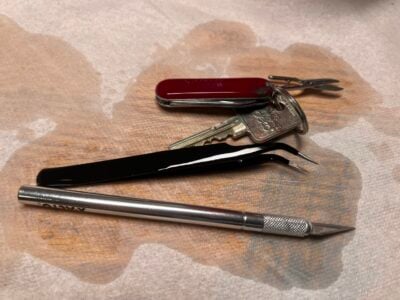 exacto knife, tweezers, a keychain with the scissors from my multitool