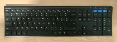 Black bluetooth keyboard sitting on desk