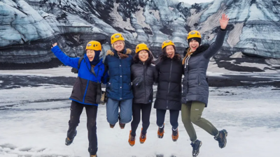 StartLab students stand in front of a glacier during their TechTrek to Iceland.