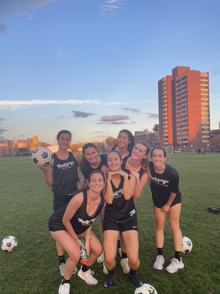 Team smiling at sunset.