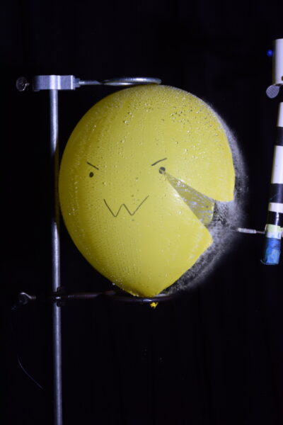 strobe photo of a balloon being popped