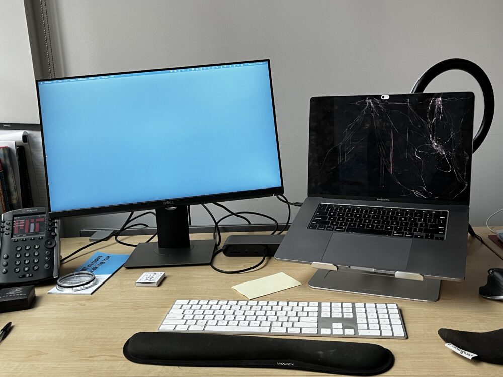 laptop next to an external monitor