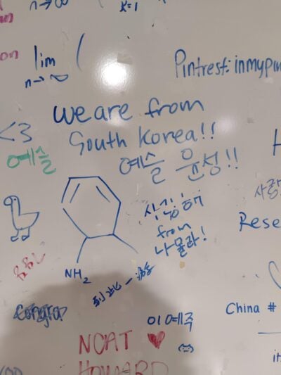 a whiteboard saying "we are from South Korea"