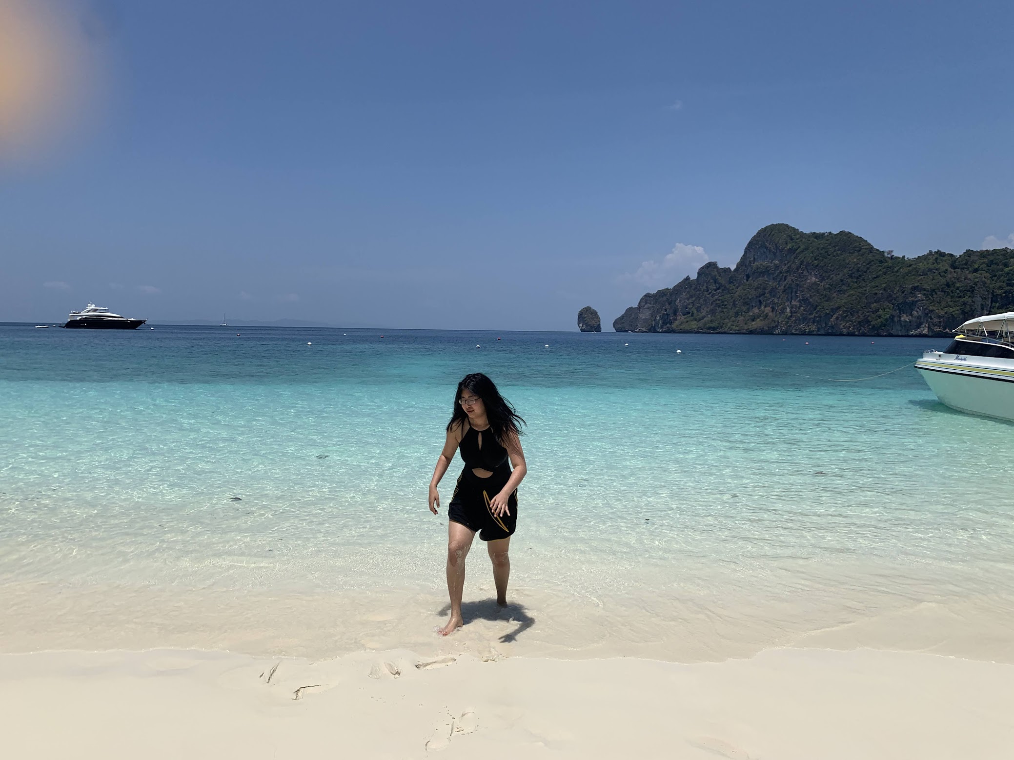 girl on a beach walking in the sand