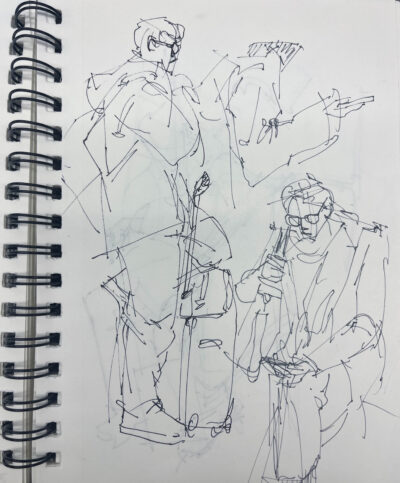 a picture of a sketchbook page with a few ink drawings of people sitting and looking at their phones