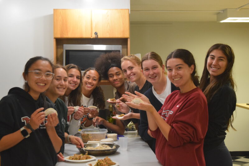 Team making dumplings together.