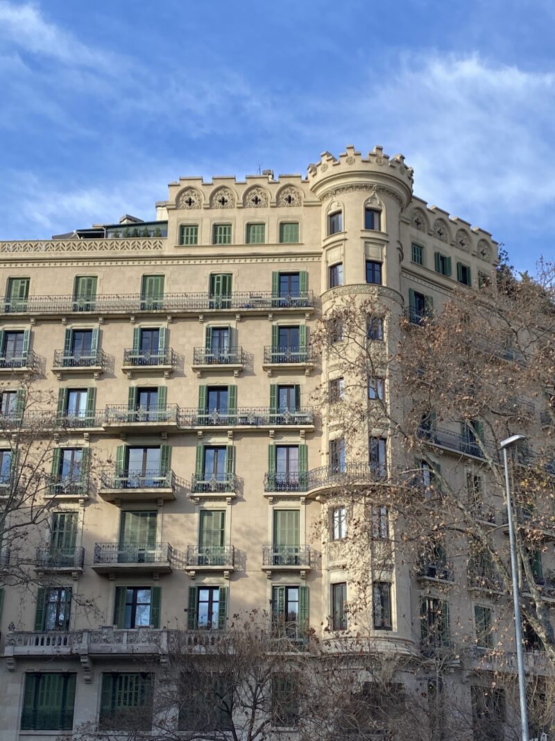 side of a building with archaic windows and arches