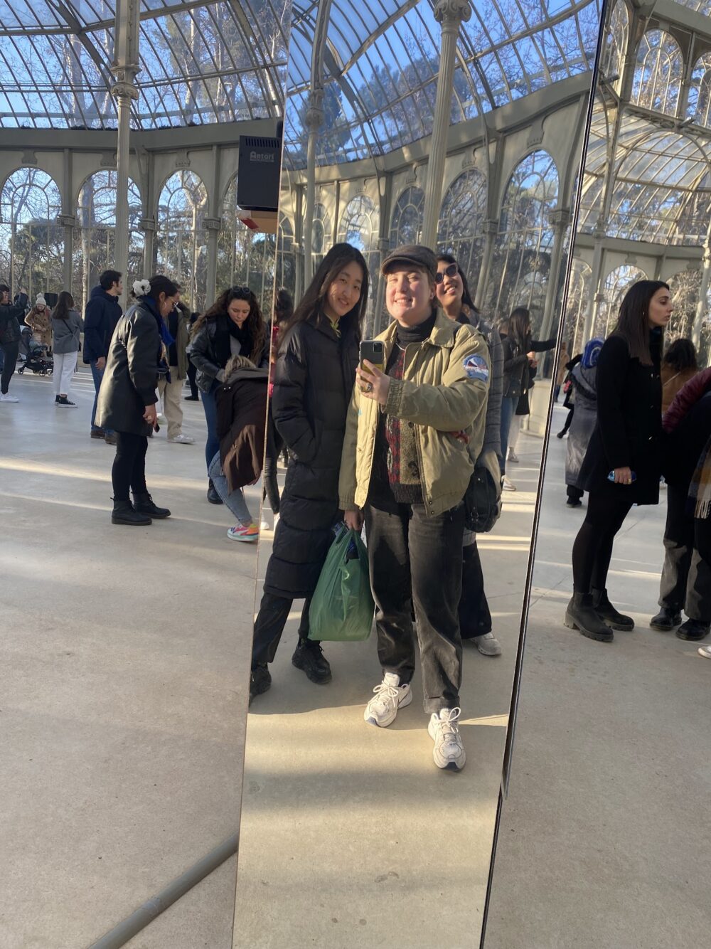 three friends taking a mirror selfie
