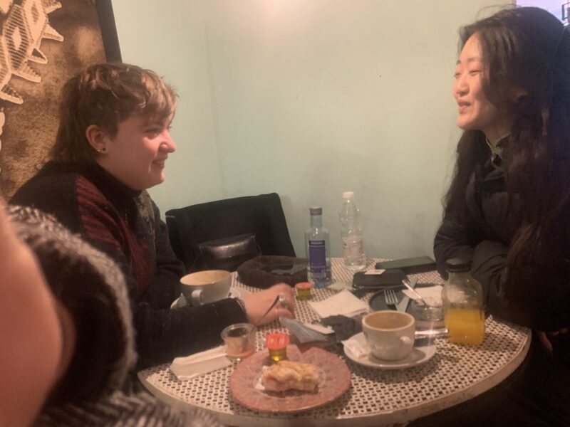 two people getting breakfast at a cafe