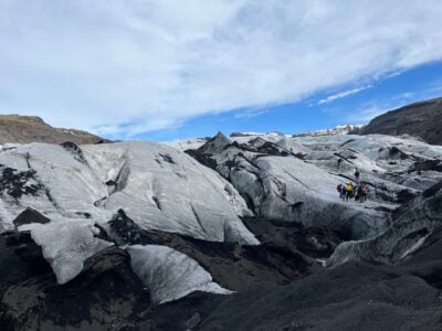 image of glacier covered w/ black ash