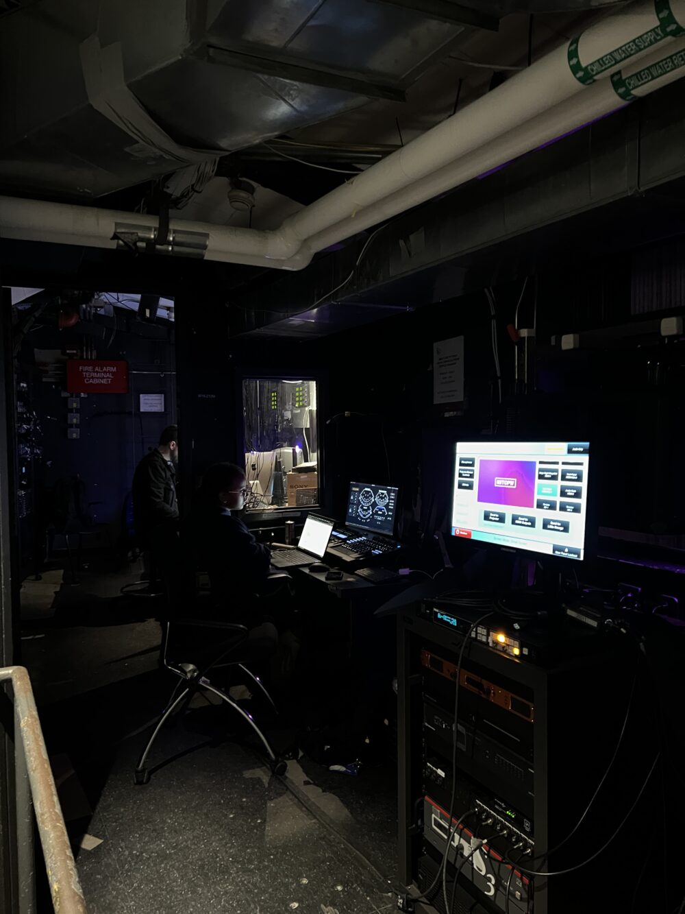 Kresge Auditorium's tech booth, featuring the lighting and sound controls.
