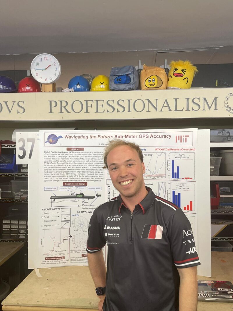Presenter smiling in front of his poster.